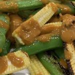 Charred baby sweet corn with peanut sauce